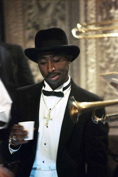 tupac in suit.